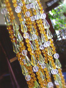 Elegant Living Room Beads Partition In Lime Green And Champagne Shades