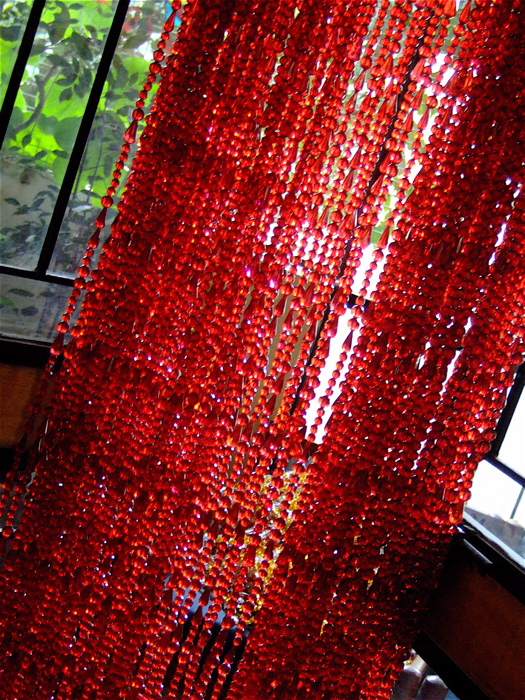 Beaded doorway treatment for modern interiors