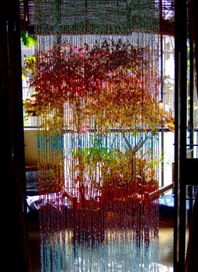 rainbow bead curtain in balcony doorway